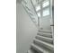 Staircase featuring natural wood and white trim, creating a bright and inviting entrance at 2790 Burden Creek Rd, Johns Island, SC 29455