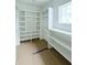Well-organized walk-in closet with shelving, drawers, and a window for natural light at 2790 Burden Creek Rd, Johns Island, SC 29455