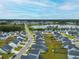 Community aerial view showcasing the neighborhood's layout, proximity to a pond and green landscape at 297 Red Leaf Blvd, Moncks Corner, SC 29461