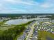 Community aerial shot reveals the attractive homes, serene lake, and lush greenery making it an inviting place at 297 Red Leaf Blvd, Moncks Corner, SC 29461