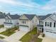 This aerial shot captures the neat arrangement of homes, each with tidy landscaping and well-maintained exteriors at 297 Red Leaf Blvd, Moncks Corner, SC 29461