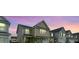 Attractive two-story home with a well-kept lawn and neighborhood street view during the evening at 297 Red Leaf Blvd, Moncks Corner, SC 29461