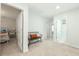 Hallway with plush carpet, bench seating, and doorways leading to bedrooms and bathrooms at 297 Red Leaf Blvd, Moncks Corner, SC 29461