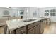 Open kitchen with a center island, stainless appliances, and a view into the living room at 297 Red Leaf Blvd, Moncks Corner, SC 29461