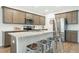 Modern kitchen with granite countertops, stainless steel appliances, and a breakfast bar at 297 Red Leaf Blvd, Moncks Corner, SC 29461