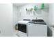 Laundry room featuring modern, front-loading washer and dryer units and wire shelving at 297 Red Leaf Blvd, Moncks Corner, SC 29461