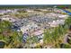 An aerial view of a commercial development featuring shops and parking lots surrounded by trees at 341 Witch Hazel St, Summerville, SC 29486