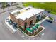 Aerial view of the Starbucks location featuring outdoor seating, a drive-thru, and parking at 341 Witch Hazel St, Summerville, SC 29486