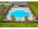 Aerial view of the community pool, playground, and lounge area surrounded by manicured grounds at 341 Witch Hazel St, Summerville, SC 29486