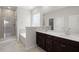 Bathroom features a double vanity, soaking tub, and glass-enclosed shower at 341 Witch Hazel St, Summerville, SC 29486