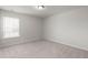 Bedroom with neutral carpet, white walls, and window for natural light at 341 Witch Hazel St, Summerville, SC 29486