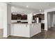Modern kitchen featuring dark wood cabinets, stainless steel appliances, and granite countertops at 341 Witch Hazel St, Summerville, SC 29486
