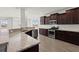 Well-designed kitchen with granite countertops, stainless appliances, and dark wood cabinets at 341 Witch Hazel St, Summerville, SC 29486