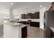 Stylish kitchen with stainless steel appliances, granite countertops, and dark wood cabinetry at 341 Witch Hazel St, Summerville, SC 29486