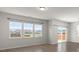 Bright living room featuring hardwood floors and a large window for natural light and neighborhood views at 341 Witch Hazel St, Summerville, SC 29486