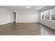 Spacious living room with hardwood floors and ample natural light from large windows at 341 Witch Hazel St, Summerville, SC 29486