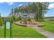 Community playground with slides and play equipment, surrounded by trees and green space at 341 Witch Hazel St, Summerville, SC 29486