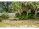 Backyard landscaping features a tiered stone retaining wall with green foliage and mulch at 3632 Locklear Ln, Mount Pleasant, SC 29466