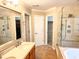 Well-lit bathroom with tiled floors, glass shower, and double sink vanity at 3632 Locklear Ln, Mount Pleasant, SC 29466