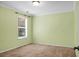This bright bedroom is freshly painted with a window with blinds and cozy carpet at 3632 Locklear Ln, Mount Pleasant, SC 29466