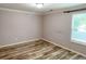 Bedroom with laminate flooring and natural light through the window at 3632 Locklear Ln, Mount Pleasant, SC 29466