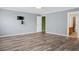 Bedroom has wood flooring and a wall mount for a television set at 3632 Locklear Ln, Mount Pleasant, SC 29466