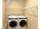 Functional laundry room with modern front-load washer and dryer and shelving for storage at 3632 Locklear Ln, Mount Pleasant, SC 29466