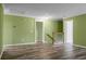 Spacious living room with wood floors, neutral walls, white trim and an open floor plan at 3632 Locklear Ln, Mount Pleasant, SC 29466