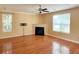 Inviting living room with a cozy fireplace, hardwood floors, and natural light at 3632 Locklear Ln, Mount Pleasant, SC 29466