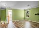 Bright living room with hardwood floors and light green paint showcasing stairs and lots of natural light at 3632 Locklear Ln, Mount Pleasant, SC 29466