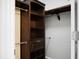 A large walk-in closet with custom wood shelving and rods for hanging clothes at 3632 Locklear Ln, Mount Pleasant, SC 29466