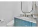 Chic bathroom with blue vanity, marble countertop, modern fixtures, and a frameless mirror at 3864 Summerton St, Mount Pleasant, SC 29466