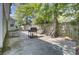 View of the backyard featuring a large grill and seating area with a wooden fence at 406 Carolina Cir, Ladson, SC 29456