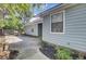 View of a backyard with a grill, blue vinyl siding and a concrete patio at 406 Carolina Cir, Ladson, SC 29456