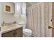 Bathroom featuring a sink, toilet, vanity, and shower with patterned curtain at 406 Carolina Cir, Ladson, SC 29456