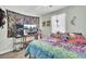 Fun bedroom with decorative tapestry, a window, and a TV, showcasing a unique style at 406 Carolina Cir, Ladson, SC 29456