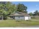 Inviting exterior showcasing blue siding, a well-manicured lawn, and an attached garage, offering suburban charm at 406 Carolina Cir, Ladson, SC 29456