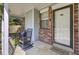 Charming front porch featuring rocking chairs and brick accents, inviting relaxation and curb appeal at 406 Carolina Cir, Ladson, SC 29456