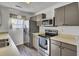 Well-equipped kitchen with stainless steel appliances, modern cabinets, and ample counter space at 406 Carolina Cir, Ladson, SC 29456