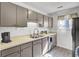 Functional kitchen with stainless steel appliances and gray cabinetry, ideal for cooking at 406 Carolina Cir, Ladson, SC 29456