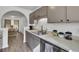 Well-lit kitchen with stainless steel appliances, gray cabinets, and plenty of counter space at 406 Carolina Cir, Ladson, SC 29456