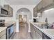 Spacious kitchen featuring stainless steel appliances and a view into the dining area at 406 Carolina Cir, Ladson, SC 29456