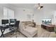 Spacious living room with a cozy sectional, a TV, hardwood floors, and a bright atmosphere, ideal for modern living at 406 Carolina Cir, Ladson, SC 29456