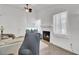 Well-lit living room featuring hardwood floors, a cozy fireplace, a TV, and a comfortable sectional sofa at 406 Carolina Cir, Ladson, SC 29456