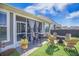Back yard patio with outdoor seating, a fire pit, and lush green grass at 413 Eagleview Dr, Moncks Corner, SC 29461