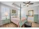 Charming bedroom showcases a four-poster bed, hardwood floors, shuttered windows, and soothing decor at 413 Eagleview Dr, Moncks Corner, SC 29461