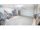 A spacious two-car garage offers epoxy floors, storage shelves, and a garage door opener at 413 Eagleview Dr, Moncks Corner, SC 29461