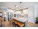 The kitchen includes stainless steel appliances, a kitchen island and white cabinets at 413 Eagleview Dr, Moncks Corner, SC 29461
