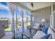 Comfortable screened-in patio with stylish furniture and a view of the manicured backyard at 413 Eagleview Dr, Moncks Corner, SC 29461