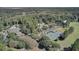 Stunning aerial view of community center with pool, tennis courts, parking and clubhouse surrounded by lush green trees at 4227 Sawgrass Dr, North Charleston, SC 29420